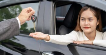 Customer receiving car keys for a long-term car rental while relocating for work in Palo Alto.
