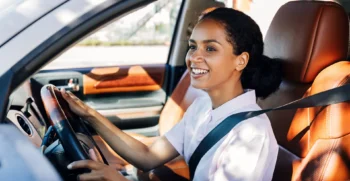 Driver enjoying a comfortable SUV rental in Austin for business travel, family trips, or exploring the city.