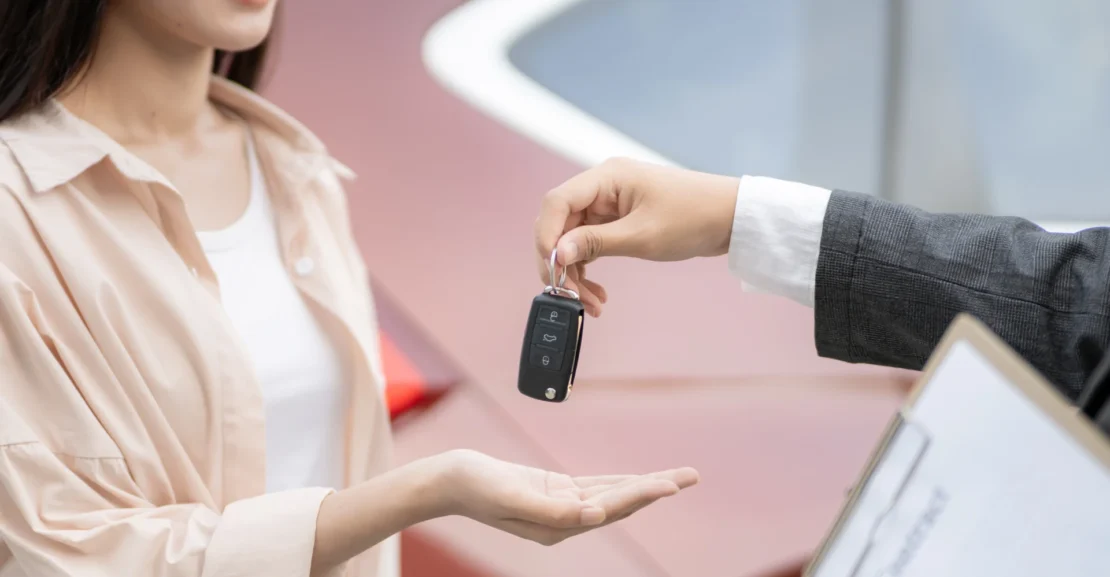 Customer receiving keys for an SUV rental in San Jose for comfortable business, airport, or leisure travel.