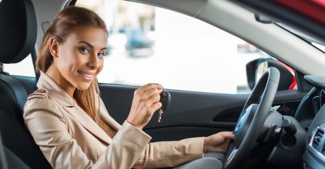 Business traveler driving a premium vehicle for an executive trip.