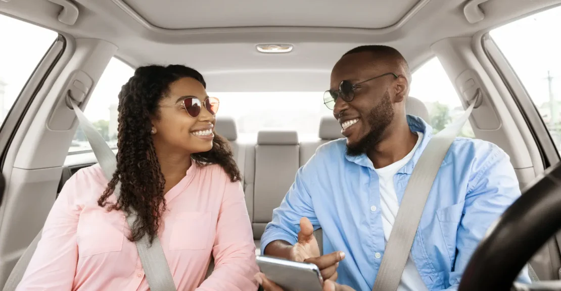 Business travelers riding in a vehicle while planning a multi-stop business itinerary in Palo Alto.