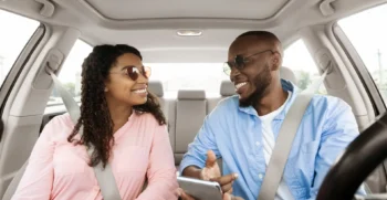 Business travelers riding in a vehicle while planning a multi-stop business itinerary in Palo Alto.